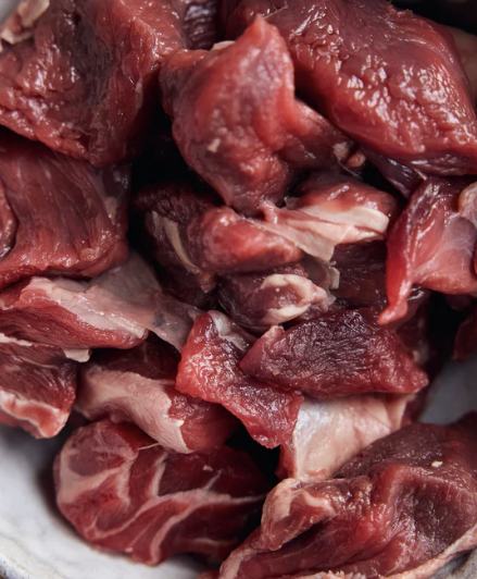 Diced wild venison shoulder, deep ruby colour