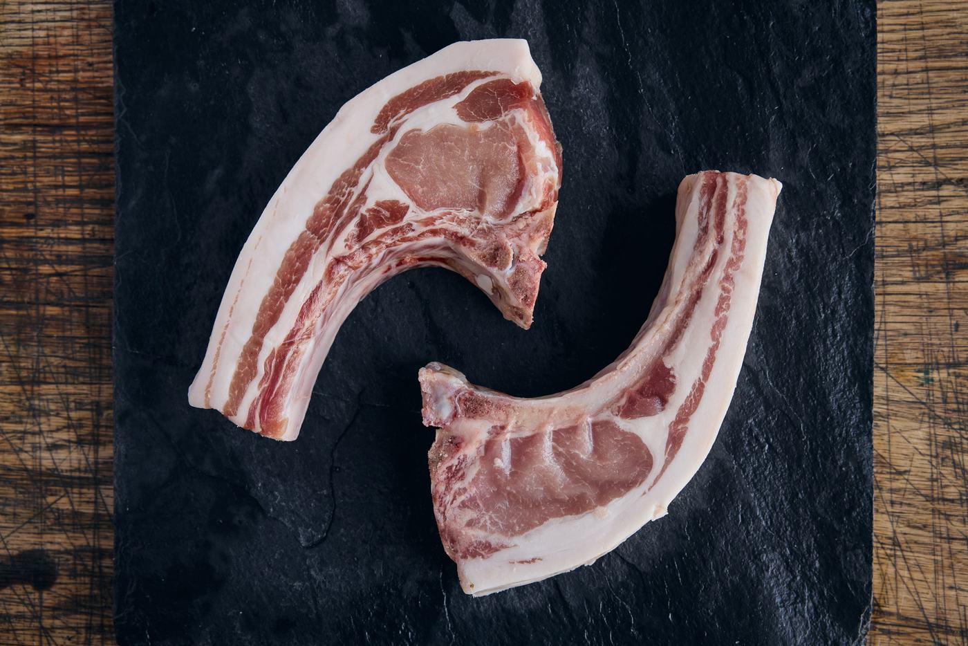 Thick-cut bone-in pork chop on butcher paper