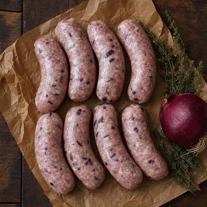 Rustic raw pork and confit red onion sausages